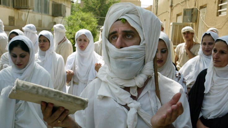 An Iraqi Mandean priest conducts a wedding ceremony for five couples in the ancient Aramaic language..